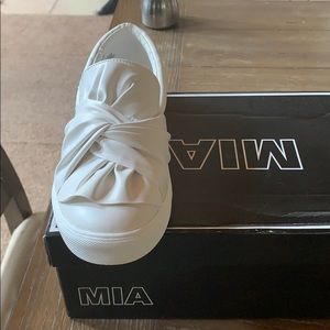 Cool white pair of slip on spring/summer shoes